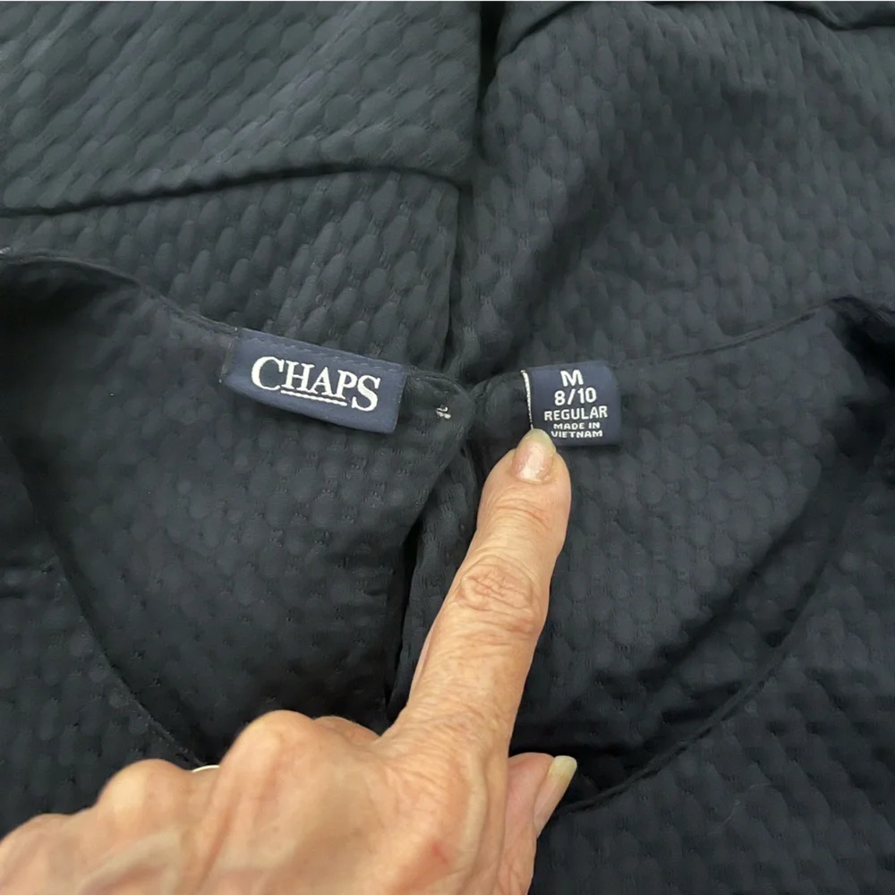 Chaps girls, navy blue jumper flounce hemline and a keyhole closure Size medium.